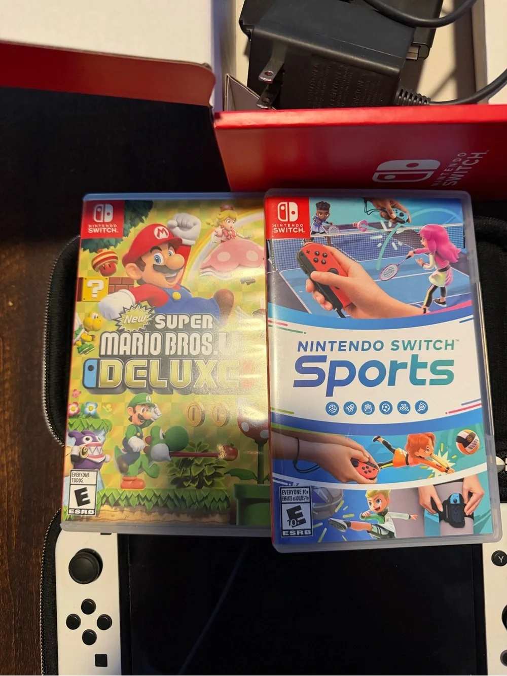 Nintendo Switch OLED Console Bundle in White with Black Case and Two Games